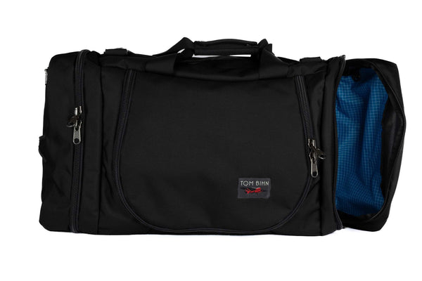 A Black Ballistic Aeronaut 45 with the end pocket open showing the Island (bright blue) Halcyon.